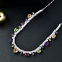 multi gemstone statement necklace in rhodium over sterling silver shown in a lifestyle photo