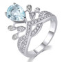 sky blue topaz and white zircon crown ring in rhodium over sterling silver