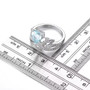 sky blue topaz and white zircon crown ring in rhodium over sterling silver shown for size comparison
