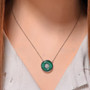 malachite and white zircon circle pendant necklace in rhodium over sterling silver worn around the neck
