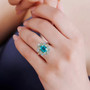blue and green quartz triplet peridot apatite and zircon ring in rhodium over sterling silver worn on a hand
