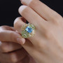 blue and green quartz triplet peridot citrine and zircon ring in rhodium over sterling silver worn on a hand