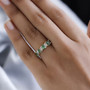 tsavorite garnet and white zircon band ring in 18k yellow gold over sterling silver worn on a hand