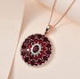 anthill garnet and white zircon pendant necklace in 18k rose gold over sterling silver shown in a lifestyle photo