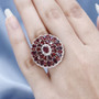 anthill garnet and white zircon ring in 18k rose gold over sterling silver worn on a hand