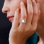 white freshwater pearl and cz crossover band ring in rhodium over sterling silver worn on a hand
