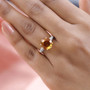 citrine and white zircon ring in 18k yellow gold over sterling silver worn on a hand