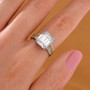 moissanite and yellow sapphire ring in rhodium over sterling silver worn on a hand