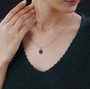 kyanite tsavorite garnet and zircon pendant necklace in rhodium over sterling silver worn around the neck