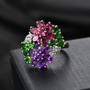 multi gemstone flower cluster ring in rhodium over sterling silver shown in a lifestyle photo