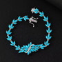 turquoise and moissanite bracelet in rhodium over sterling silver shown in a lifestyle photo
