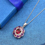 rhodolite garnet amethyst and zircon pendant necklace in rhodium over sterling silver shown in a lifestyle photo