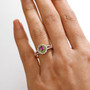 purple garnet chrome diopside and zircon halo ring in 18k rose gold over sterling silver worn on a hand