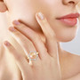 golden south sea pearl and moissanite halo ring in 18k yellow gold over sterling silver worn on a hand