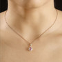 purple sapphire and diamond pear halo pendant necklace in solid 10k rose gold worn around the neck
