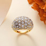 moissanite dome ring in 18k yellow gold over sterling silver shown in a lifestyle photo