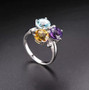 close up of amethyst citrine blue topaz and white zircon ring in rhodium over sterling silver