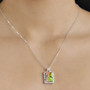 ammolite and white zircon halo pendant necklace in rhodium over sterling silver worn around the neck