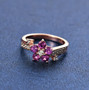 purple garnet and white zircon ring in 18k rose gold over sterling silver shown in a lifestyle photo