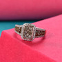 champagne and white diamond cluster halo ring in 18k rose gold over sterling silver shown in a lifestyle photo