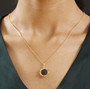 garnet and white zircon cluster pendant necklace in 18k yellow gold over sterling silver worn around the neck