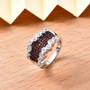 garnet and white zircon cluster band ring in rhodium over sterling silver shown in a lifestyle photo