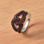 garnet interlocking cluster ring in rhodium over sterling silver shown in a lifestyle photo