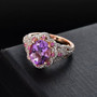 rose de france amethyst pink sapphire and white zircon halo ring in 18k rose gold over sterling silver shown in a lifestyle photo