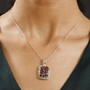 garnet and white zircon pendant necklace in 18k yellow gold and rhodium over sterling silver worn around the neck