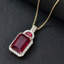 ruby (ff) and white zircon pendant necklace in 18k yellow gold over sterling silver shown in a lifestyle photo