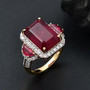 ruby (ff) and white zircon ring in 18k yellow gold over sterling silver shown in a lifestyle photo