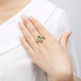 peridot and chrome diopside heart ring in rhodium over sterling silver worn on a hand