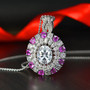 moissanite and pink sapphire pendant necklace in rhodium over sterling silver shown in a lifestyle photo