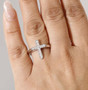 lab diamond cross ring in rhodium over sterling silver worn on a hand