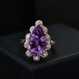 pear amethyst and white zircon ring in 18k rose gold over sterling silver shown in a lifestyle photo