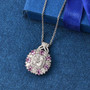 moissanite pink sapphire and pink sapphire pendant necklace in rhodium over sterling silver shown in a lifestyle photo