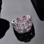 moissanite pink sapphire and pink sapphire ring in rhodium over sterling silver shown in a lifestyle photo