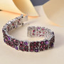 rhodolite garnet and amethyst tennis bracelet in rhodium over sterling silver shown in a lifestyle photo