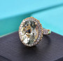 prasiolite multi tourmaline and zircon halo ring in 18k yellow gold over sterling silver shown in a lifestyle photo