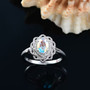 mercury mist topaz and white zircon halo ring in rhodium over sterling silver shown in a lifestyle photo