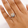 mercury mist topaz and white zircon halo ring in rhodium over sterling silver worn on a hand