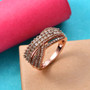 champagne diamond crossover band ring in 18k rose gold over sterling silver shown in a lifestyle photo
