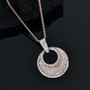 pink diamond and white diamond pendant necklace in 18k rose gold over sterling silver shown in a lifestyle photo