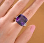 african amethyst and white topaz ring in 18k yellow gold and rhodium over sterling silver worn on a hand