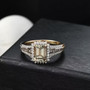 turkizite champagne and white diamond emerald halo ring in solid 14k yellow gold shown in a lifestyle photo