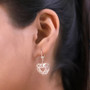 openwork filigree heart shaped lever back earrings in 18k rose gold over sterling silver worn on the ear
