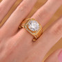 moissanite gents ring in 18k yellow gold over sterling silver worn on a hand