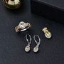 heliodor and yellow sapphire jewelry set in 18k yellow gold and rhodium over sterling silver shown in a lifestyle photo