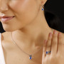 blue spinel and blue sapphire jewelry set in black and white rhodium over sterling silver shown being worn