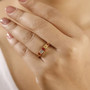 multi color sapphire five stone band ring in 18k yellow gold over sterling silver worn on a hand